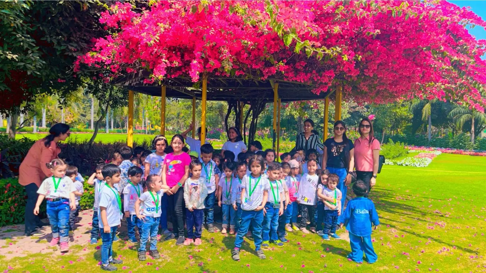 Preschool children from Buzzy Bees, New Delhi, on a supervised park picnic outing with their teachers