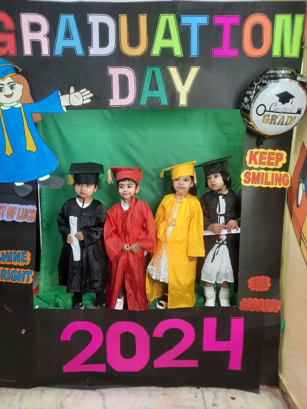 Kindergarten graduation day at Buzzy Bees in West Patel Nagar, children wearing caps and gowns
